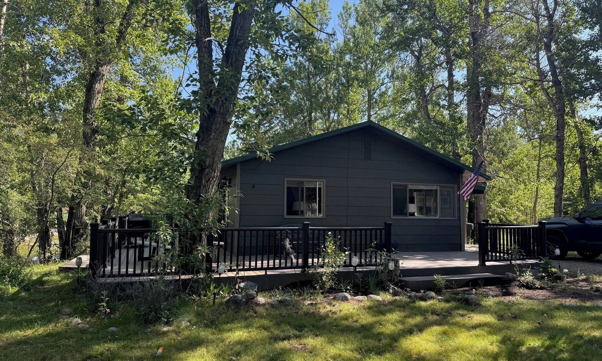 Red Lodge Cabin | Cozy Getaway in Town! Enjoy Rock Creek Flowing Just Steps from Wrap Round Deck