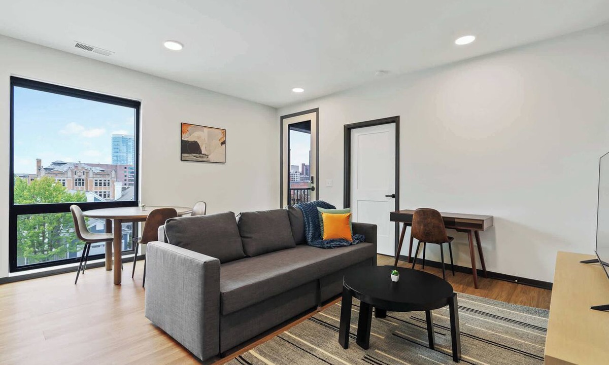 Lockerbie Square Apartment | CozySuites Mass with lounge and roof deck #7
