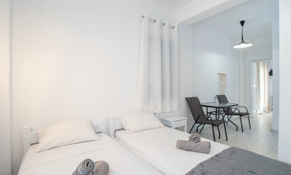 Perissa Apartment | Economy Quadruple Room 1 with Balcony and Air Conditioning