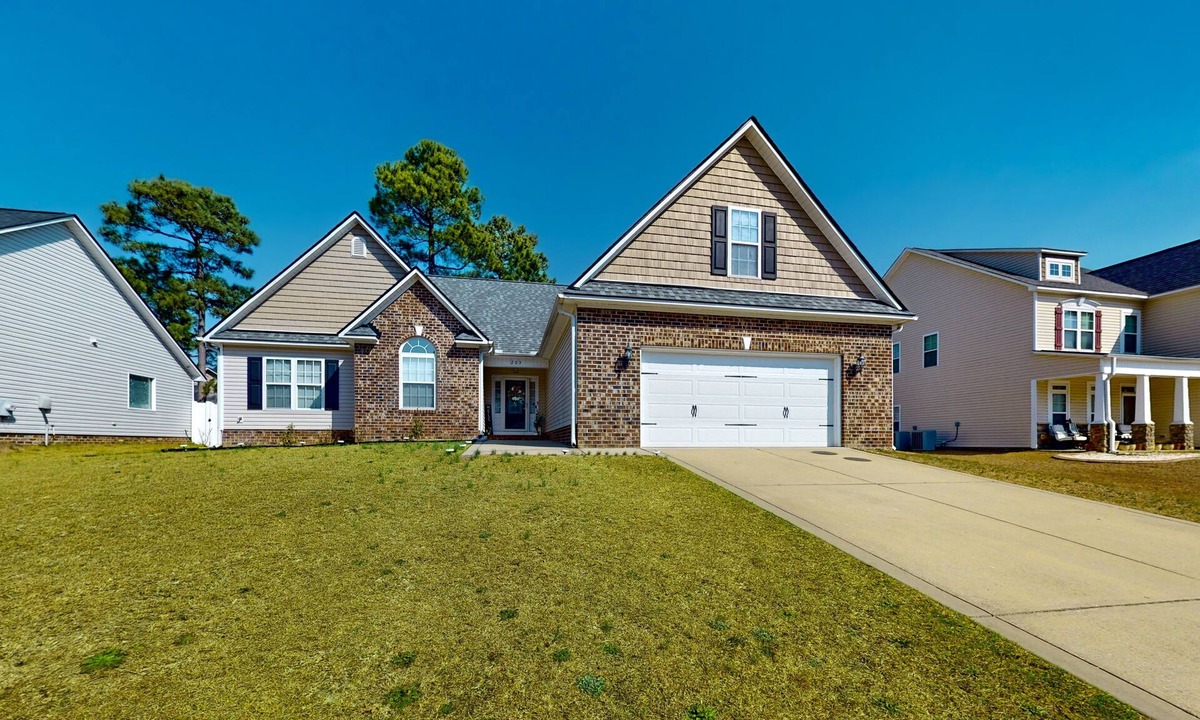 Cameron House | Lovely home with screened-in patio, fireplace, pool, playground, & gym access
