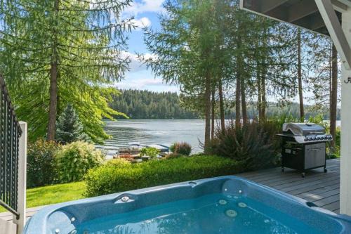 Nine Mile Falls House | Luxe Lake Home Hot Tub Private Dock Beach