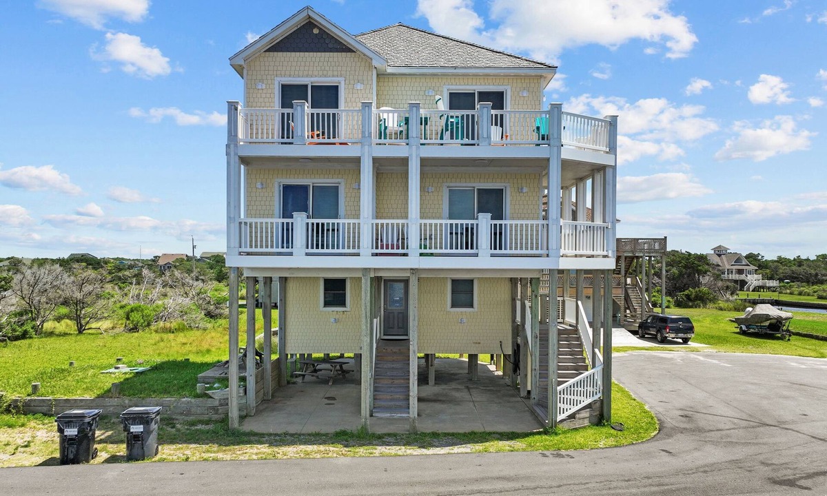 Frisco House | Waterfront home with boat dock, shared pool, & balcony with ocean view