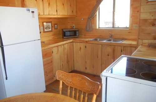 Greer Cabin | 2 BR-1BA Cabin on Main Street. Stocked trout pond, porch, grill, good dogs free🐾