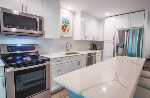 West Beach Village House | 90 Seconds to Beach! Fully Renovated Villa with Spacious Kitchen, Gorgeous Finishes & Screened Porch