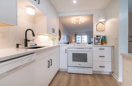 New Smyrna Beach Condo | BEACHFRONT COMPLEX FULLY RENOVATED 2025 2 BED 2 BATH 2 POOLS & 2 KIDDIE POOLS
