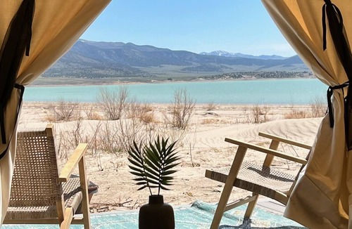 Utah House | Beautiful wall tent on sandy beach at waters edge