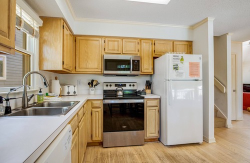 Pelican Bay House | Casual cottage w/screened porch & shared pool - walk to the beach