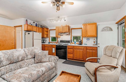 Lakeside House | Charming home with sunroom, large yard, full kitchen, & washer/dryer