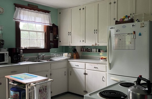 Pawcatuck House | Charming waterfront 1920s Craftsman-style home on 4+ private acres