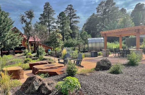 Flagstaff House | Cheerful Cabin with large stone patio and hot tub, next to trails!