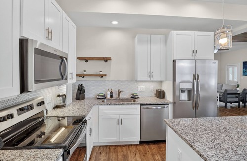 Michigan City House | Cozy Duplex Retreat | Hot Tub + Full Kitchen