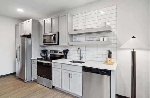 Lockerbie Square Apartment | CozySuites Mass with lounge and roof deck #26