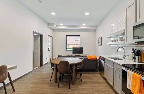 Lockerbie Square Apartment | CozySuites Mass with lounge and roof deck #1