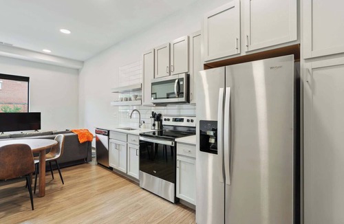Lockerbie Square Apartment | CozySuites Mass with lounge and roof deck #1