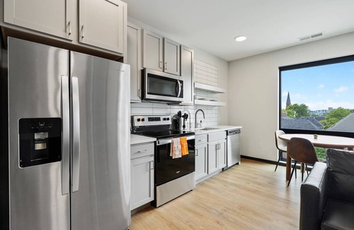 Lockerbie Square Apartment | CozySuites Mass with lounge and roof deck #2