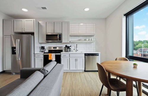 Lockerbie Square Apartment | CozySuites Mass with lounge and roof deck #7