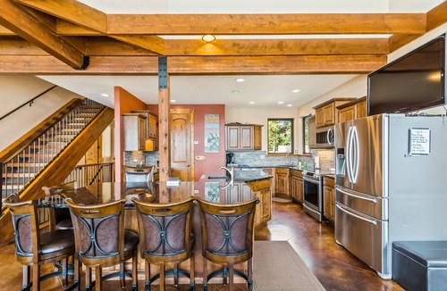 Laclede House | Custom riverfront home with private dock, game room, hot tub & heated floors