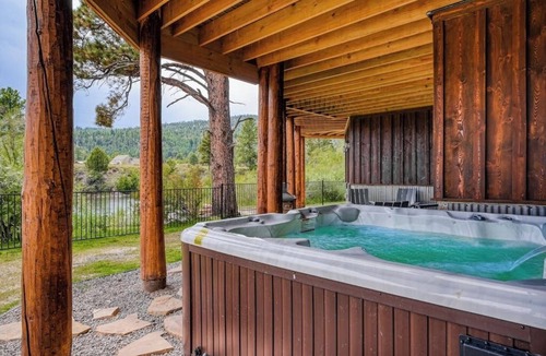 South Fork House | Custom riverfront log home w/hot tub, decks & fireplace