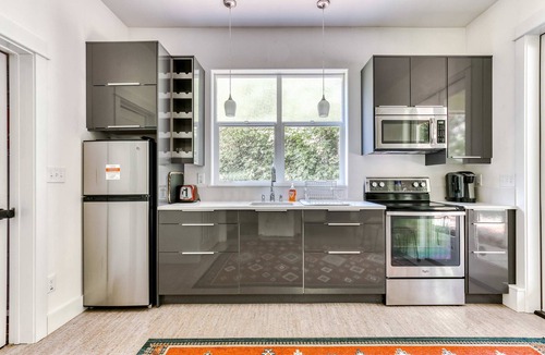 Stevenson House | Dog-friendly studio with river view, patio, grill, & shared W&D