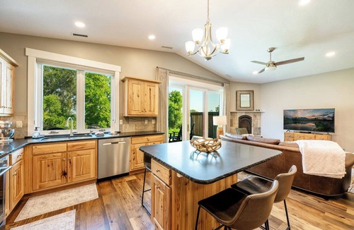 Sheridan Condo | Elegant creekside guest suite in Sheridan's Powderhorn Golf Community. This private, single-level retreat comfortably accommodates four guests, featuring a fully equipped kitchen & an expansive private patio with a BBQ grill overlooking Goose Creek.