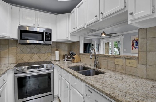 Airlie Condo | Experience Coastal Luxury at The Waterway 405: Marina Views, Pool, Dining!