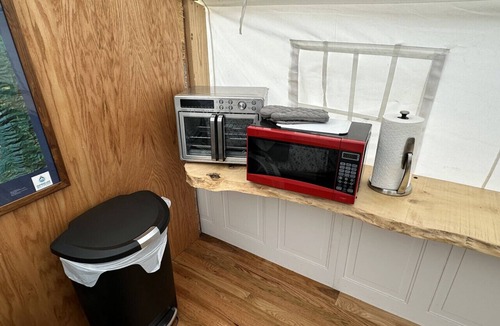 Big Arm RV Rental | GlampCamp - Luxury Wall Tent & Bathhouse