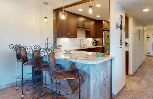Carefree Condo | Ground-floor condo with on-site pool, grills, patio, & central AC