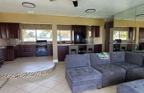 Indian River Residence House | Launch & Lounge: Rocket views, pool and dock