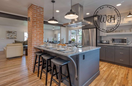 Collister House | Luxury at its Finest | Indulge in Gourmet Kitchen, Spacious Dining Area, & Plush Beds