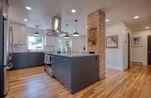 Collister House | Luxury at its Finest | Indulge in Gourmet Kitchen, Spacious Dining Area, & Plush Beds