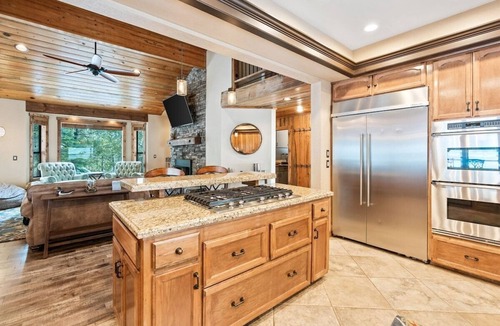 Shaver Lake House | Luxury Shaver Lake retreat with pond views, soaring wood ceilings, a stone fireplace, gourmet kitchen, four bedrooms, a loft, spacious backyard, and a brand-new spa. Perfect for families and groups seeking a mountain getaway.