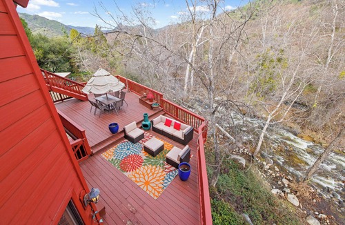 Three Rivers Ski Chalet | Majestic Riverfront Chalet is set down a serene and private drive.