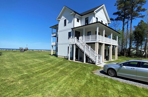 Gwynn House | New 5 bedroom home on private, sandy beach with game room and elevator.