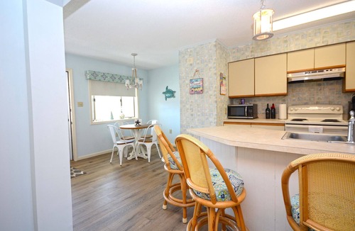 Midtown Ocean City Condo | Nice 2 bedroom condo with pristine hardwood floors, free WiFi, and an outdoor pool located midtown and only a block to the beach!