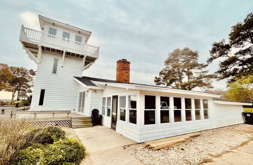 Fentress House | Peaceful Getaway At Bayfront Lighthouse. Escape To A Serene Destination.