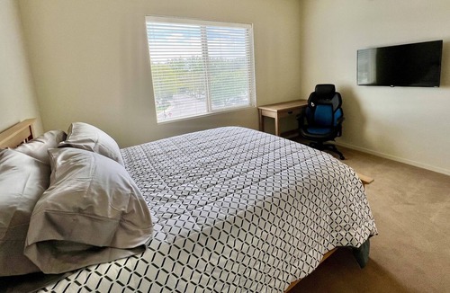 East End Apartment | Private room in modern building top floor corner. Greenbelt and mountain views!