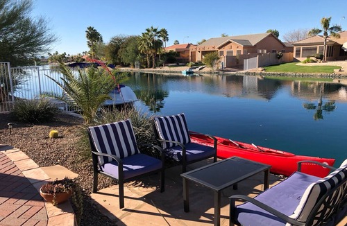 Chandler House | Resort Living! Quiet Lakefront Home. Pool, large shaded patio, fishing, sleeps 9