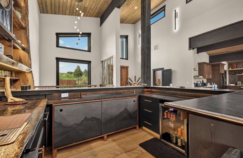 Ashton House | Riverfront 5BR lodge with hot tub, fireplace, and mountain views.