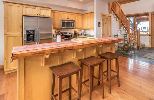 Bigfork Condo | Riverfront Bigfork Condo w/AC - Steps to Downtown, Stunning Swan River Views & Fireplace