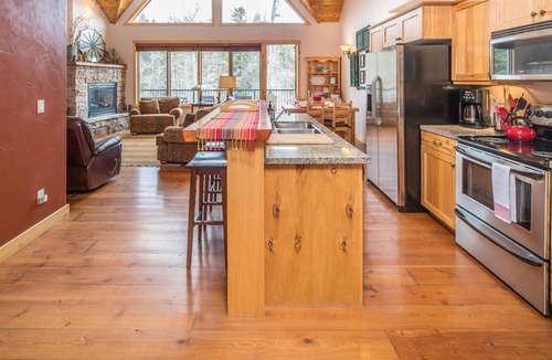 Bigfork Condo | Riverfront Bigfork Condo w/AC - Steps to Downtown, Stunning Swan River Views & Fireplace