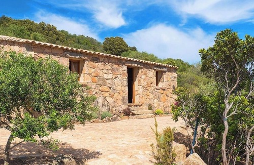 Figari House | Secluded, contemporary sheepfold for 2, nestled on a hillside with swimming pool.