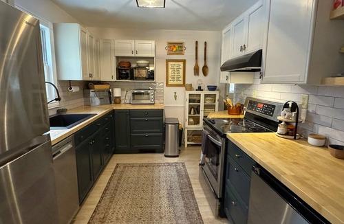 Harbert House | Serene Wooded lot kids play area hot tub screened porch