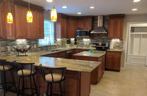West Chester House | Splash and Soak Oasis with Pool and Hot Tub