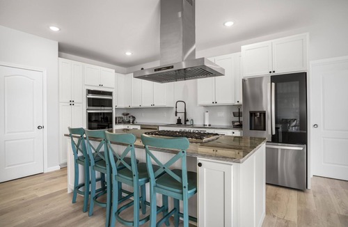 Greenbackville House | The Lighthouse | Luxury Waterfront Retreat w/Dock, Fireplace, Pools, Marina, & Golf