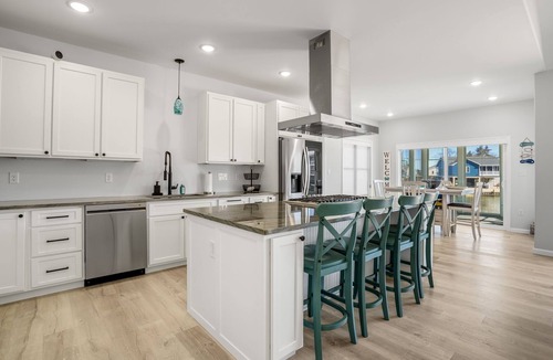 Greenbackville House | The Lighthouse | Luxury Waterfront Retreat w/Dock, Fireplace, Pools, Marina, & Golf