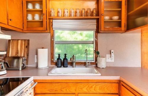Arroyo Grande Apartment | The Spartan is a fun 1950's vintage trailer under oak trees overlooking a 1 acre organic farm!