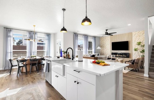 Southwest Ada County Alliance House | This 5-bedroom home has it all—gas fire pit for 8, hot tub, cornhole, ladder golf, ping pong, and a gas grill. Inside, enjoy a rock climbing wall, office desk, and a garage gym.