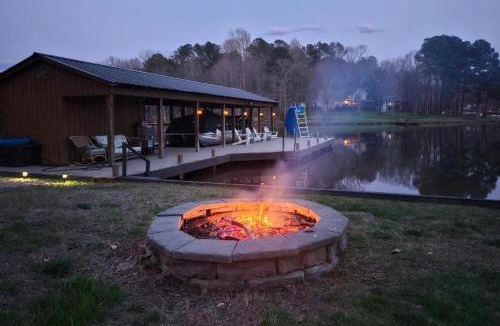Bumpass House | Tranquil lakefront retreat with hot tub, screened porch, kayaks, and more