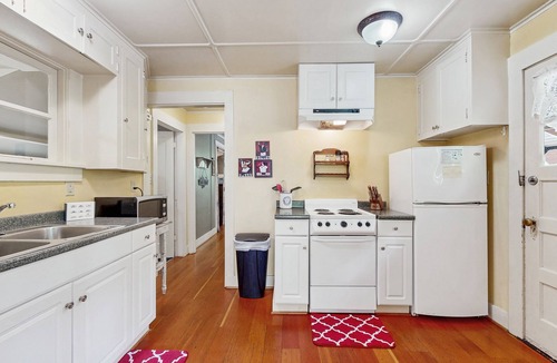 Molalla Cottage | Tranquil landscape with riverside firepit, gas grill, gas fireplace, and deck