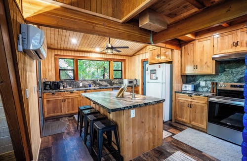 Sierra Cedars Cabin | Tucked in the trees, Cedar Hill is a cozy A-frame cabin with modern updates, a spacious kitchen, wraparound deck, and stunning views. The perfect mountain escape for families, couples, and friends—plus, it's pet-friendly!